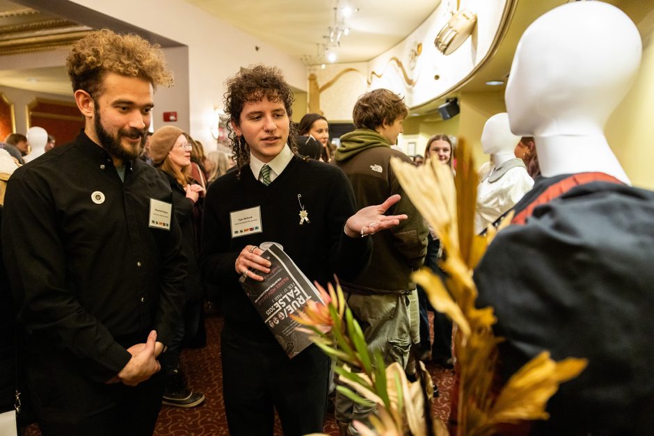 Students look at design on mannequin