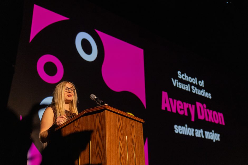 Student presents on stage