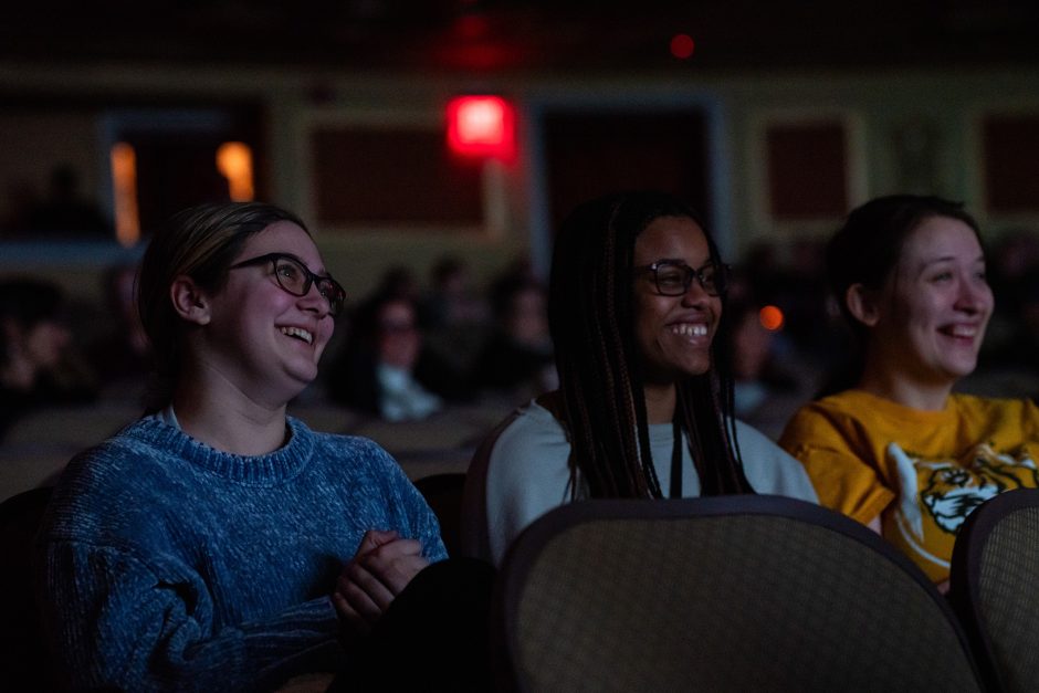 People in audience smile