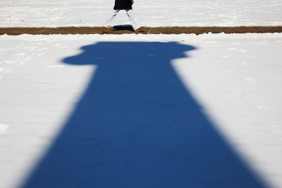 Dark, long shadow of historic column