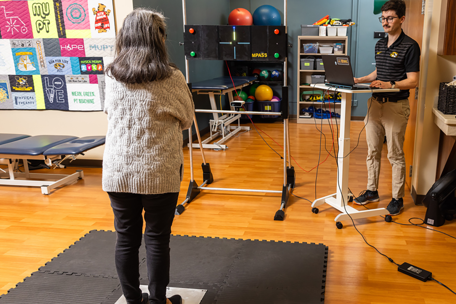 A woman standing on a force plate testing new technology. 