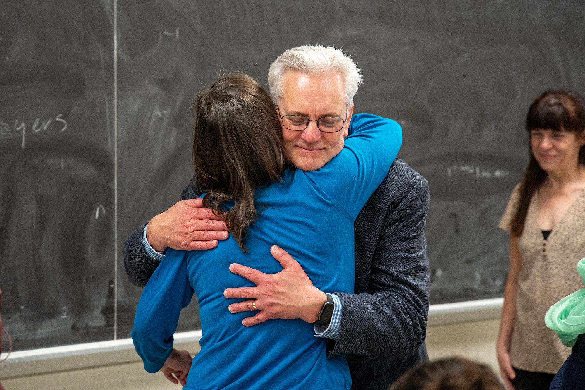 Julie Elman is congratulated by dean