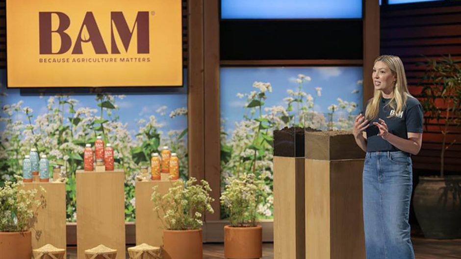 Woman standing on stage at Shark Tank.