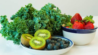 Plates of endive, berries and kiwi