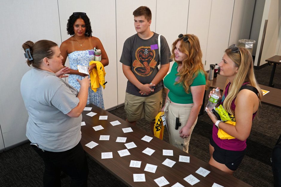 Students gather at table