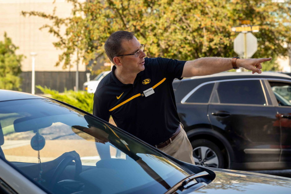 Man directs car on campus