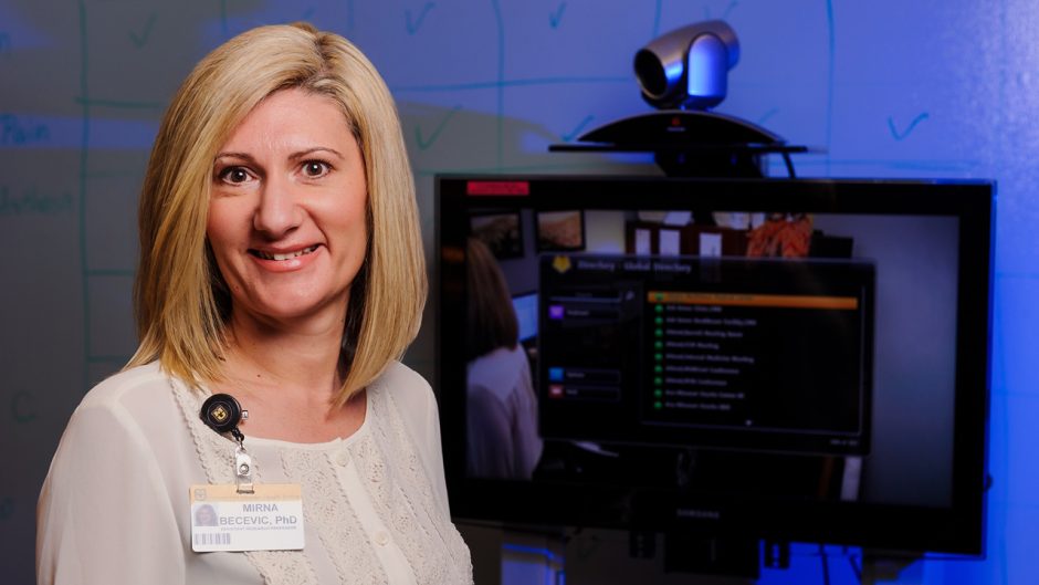 Mirna Becevic in front of monitor
