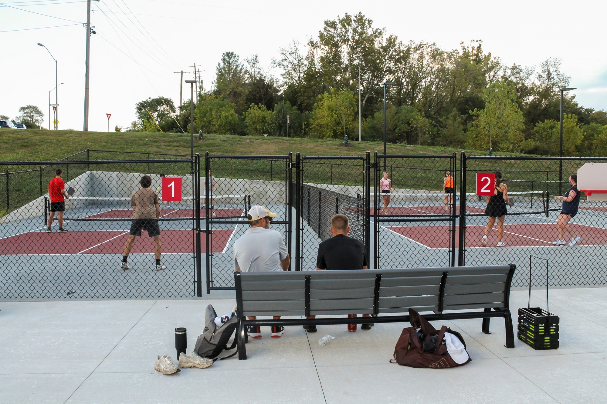 people playing pickleball on two courts