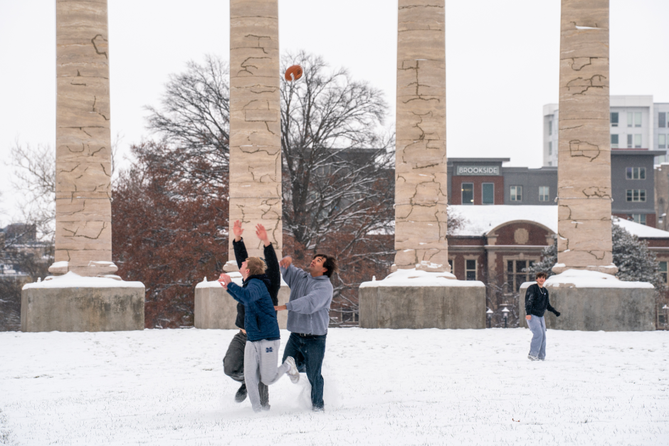 Students play in snow