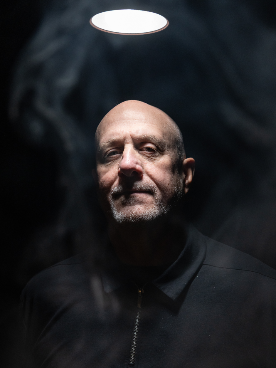 Man in black under spotlight