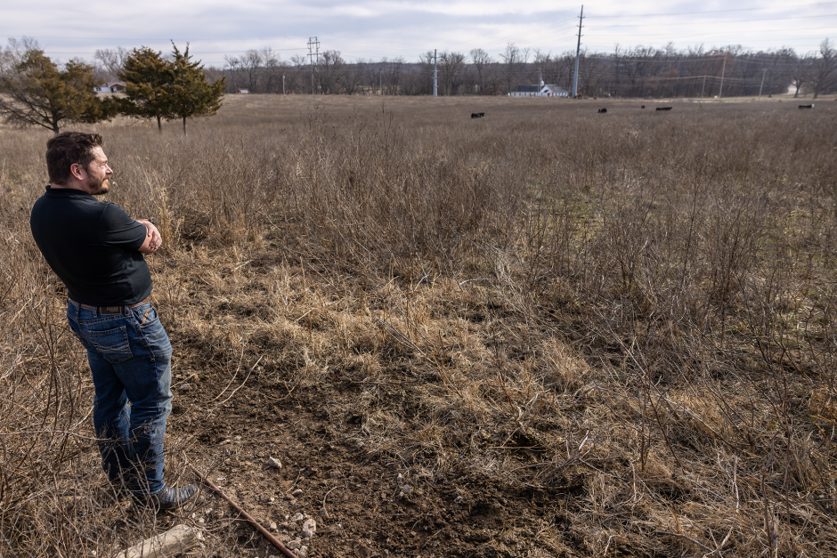 Derek Brake testing out the virtual fencing technology at Mizzou's Beef Research and Teaching Farm.