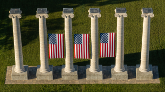 Columns at University of Missouri with American flags between them