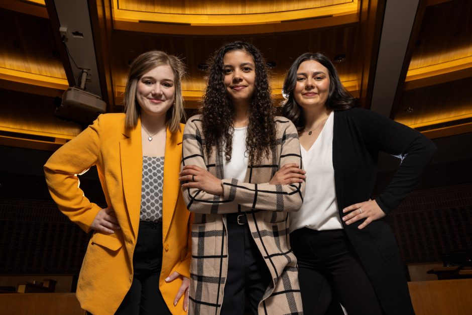 Students and professor in business attire