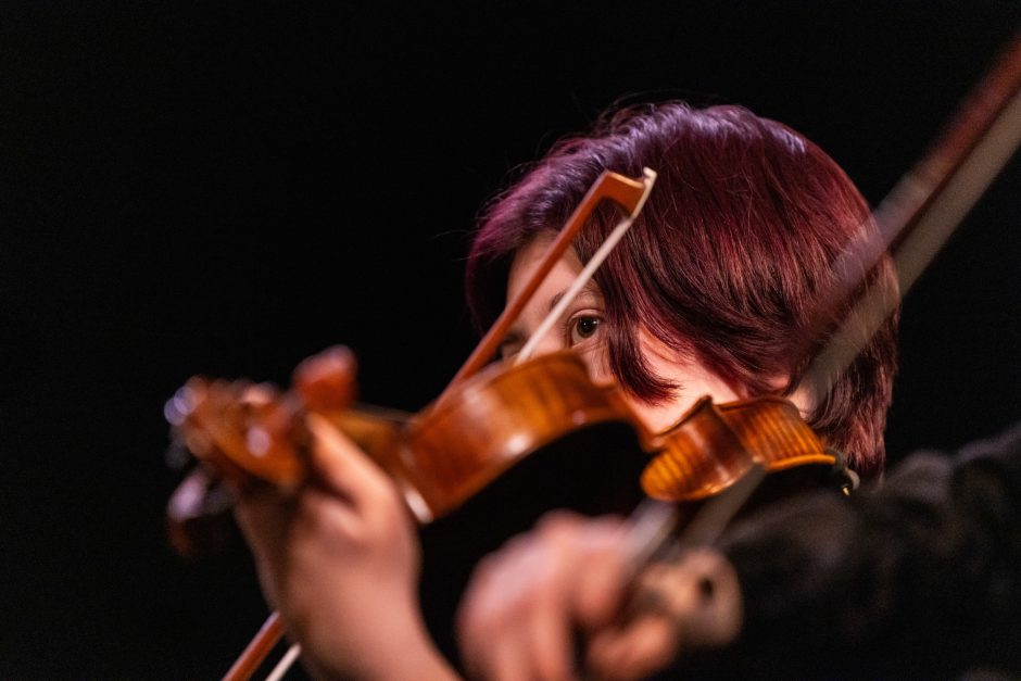 A person playing the violin