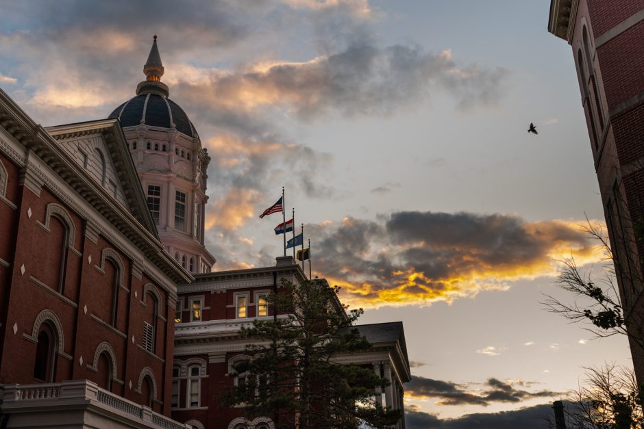 Jesse Hall under a cloudy sky