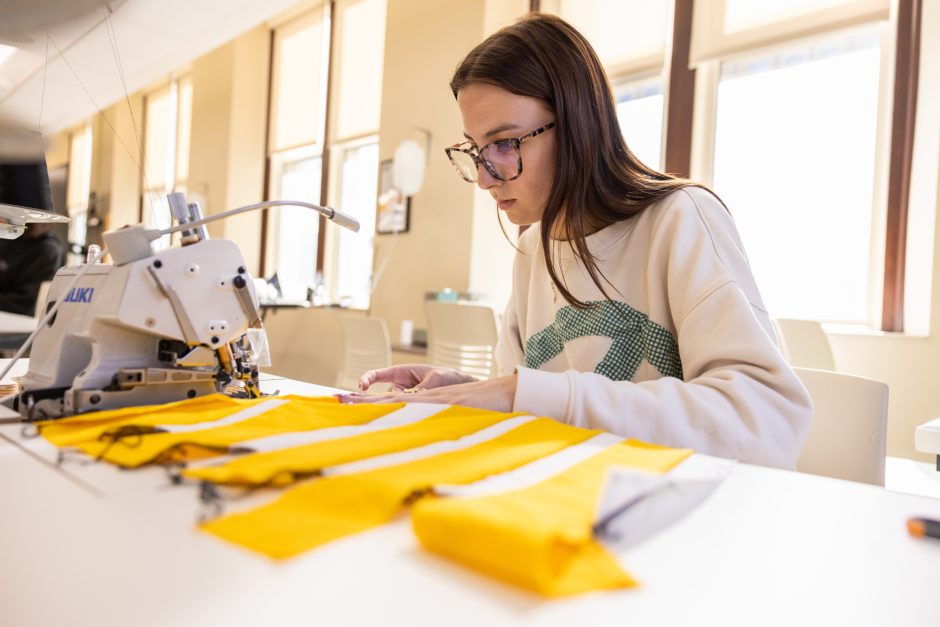Student working at sewing a piece of clothing