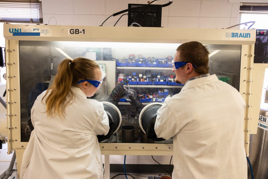 Two student researchers working in a lab