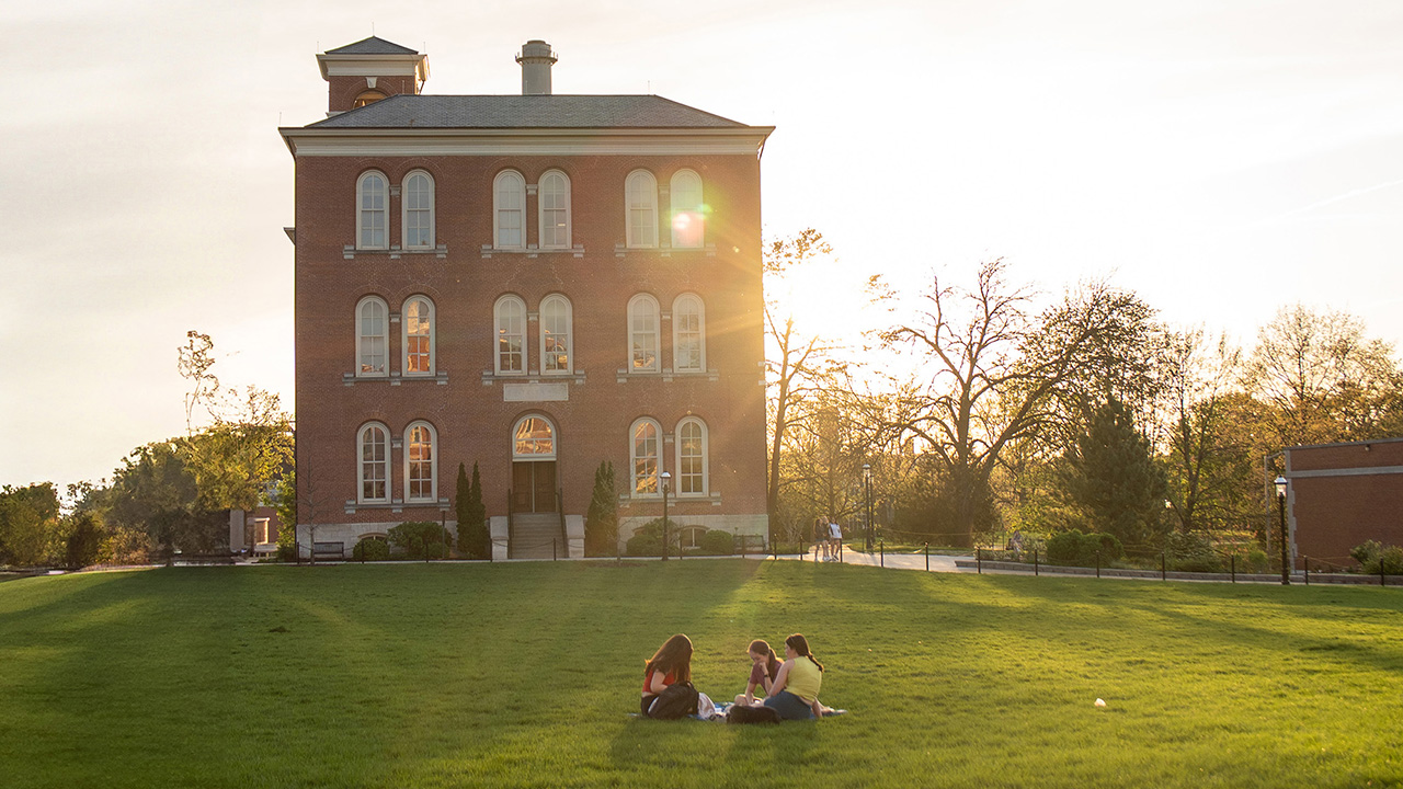Students sit on the quad.