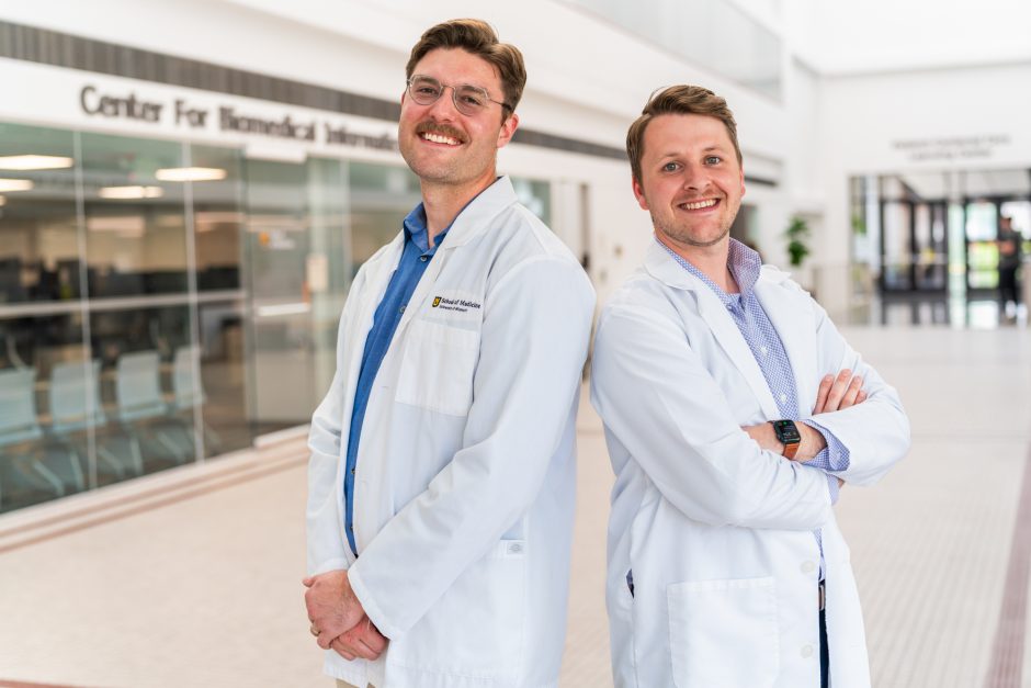 Two medical students in white coats