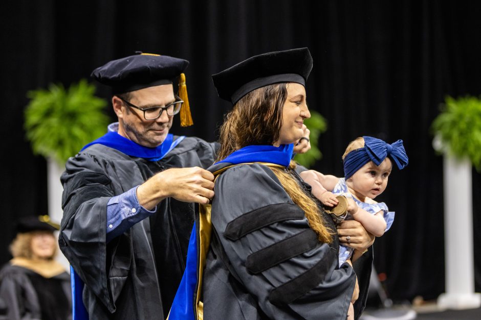 Graduate student graduate with baby