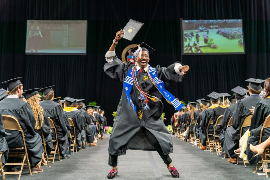Student celebrating at graduation ceremony