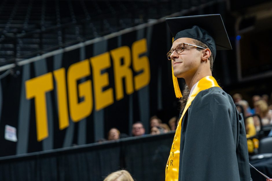 Student in cap and gown during graduation ceremony