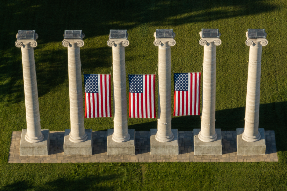 Columns at University of Missouri with American flags between them
