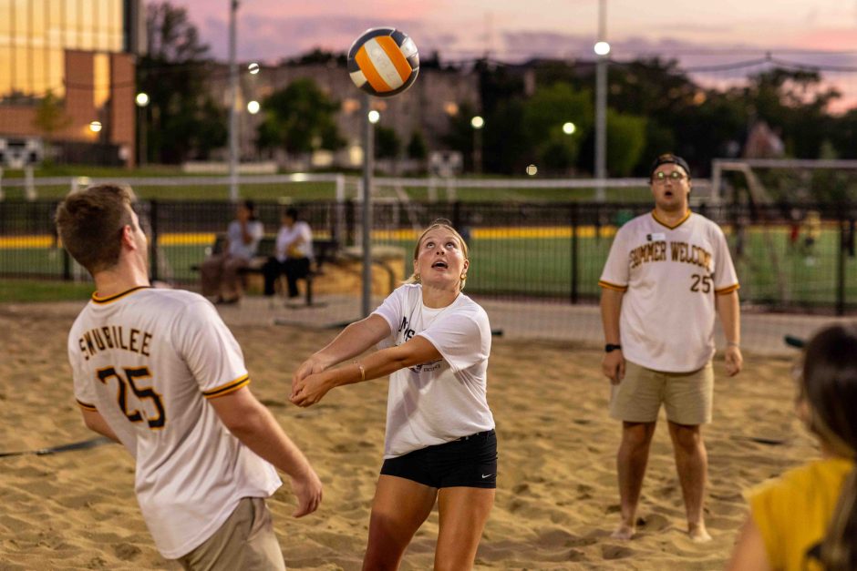 Student hitting a volleyball