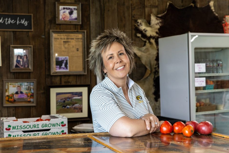 Person leaning on counter and smiling