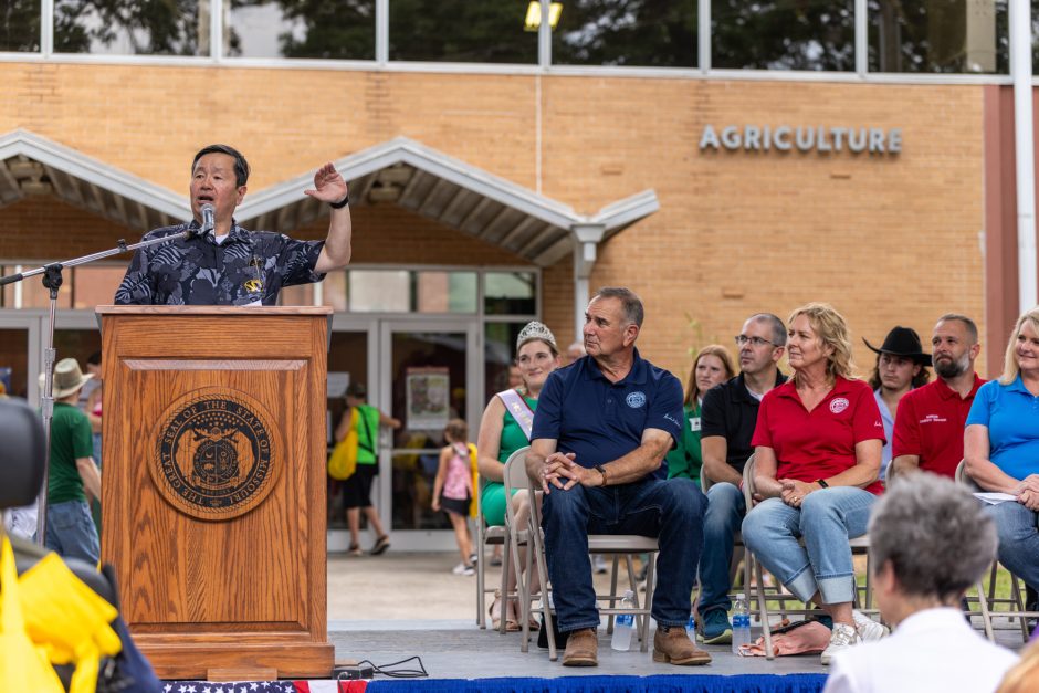 University president speaking at podium