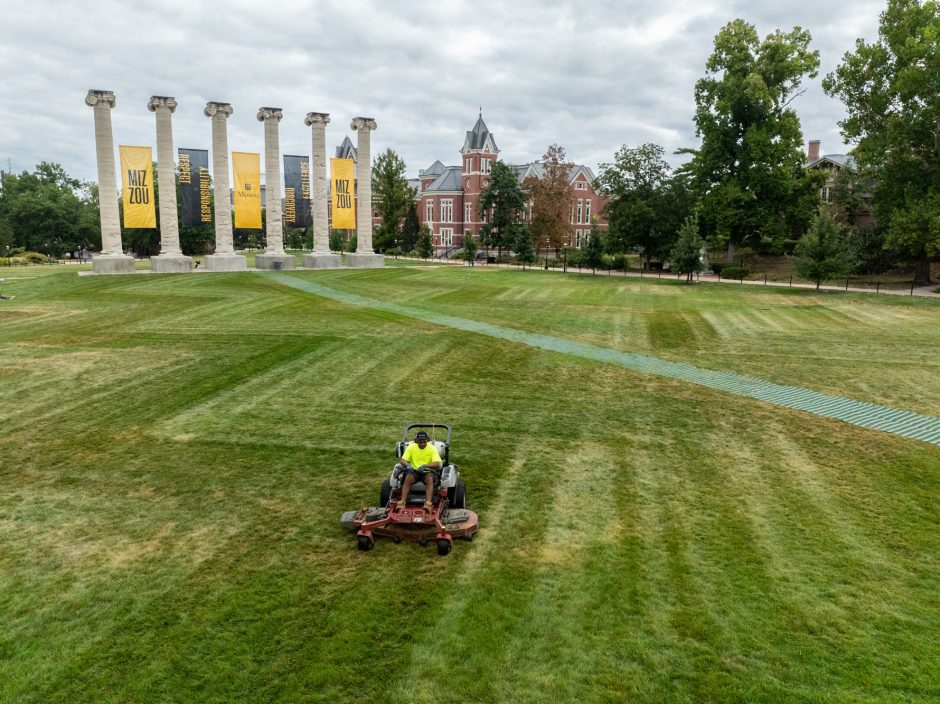 Staff member on a lawn mower