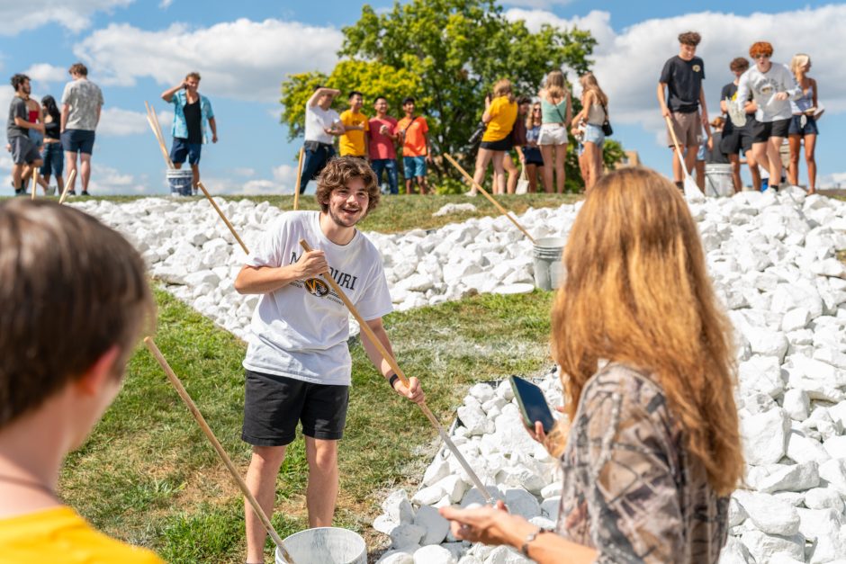 Students painting rocks