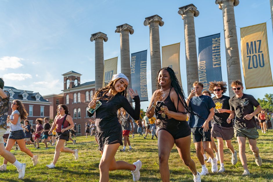 Students run through the Columns.