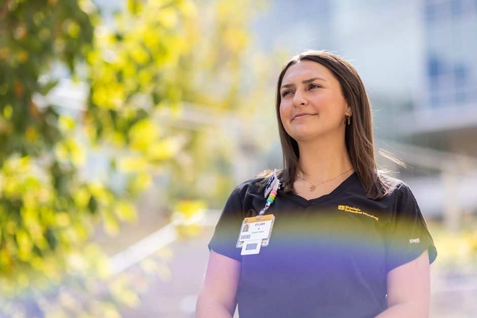 Nursing student outside in scrubs