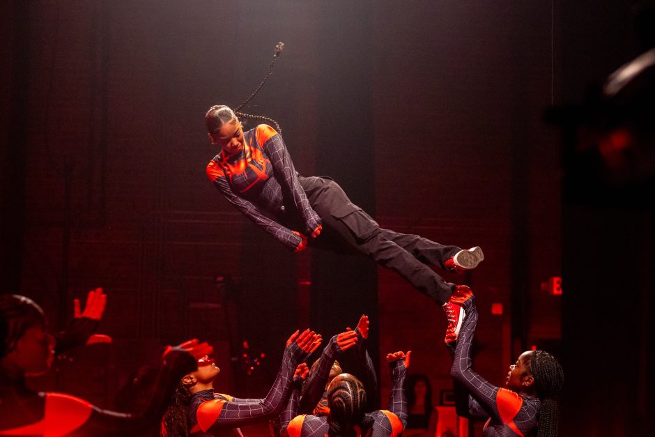 Student flying through the air as part of a dance routine