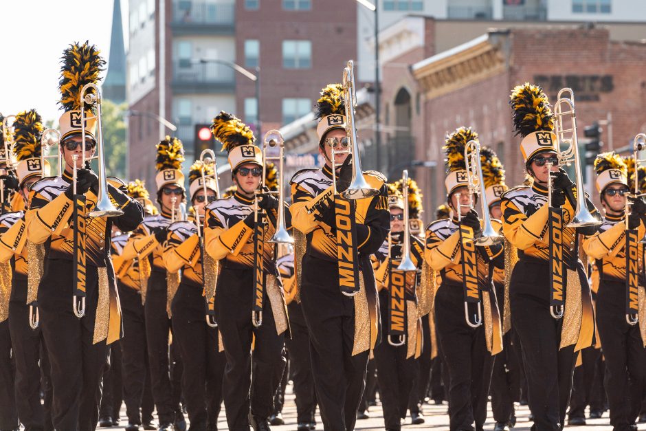 Marching Mizzou holds their instruments and marches down the street during the Homecoming parade.
