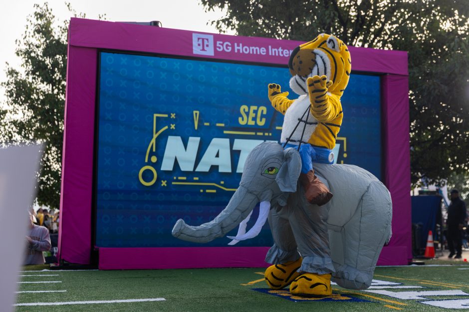 Truman the Tiger riding an inflatable elephant at SEC Nation