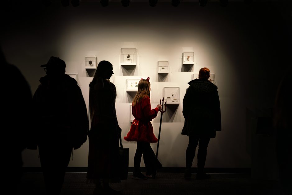 Person walking through a museum in Halloween costume