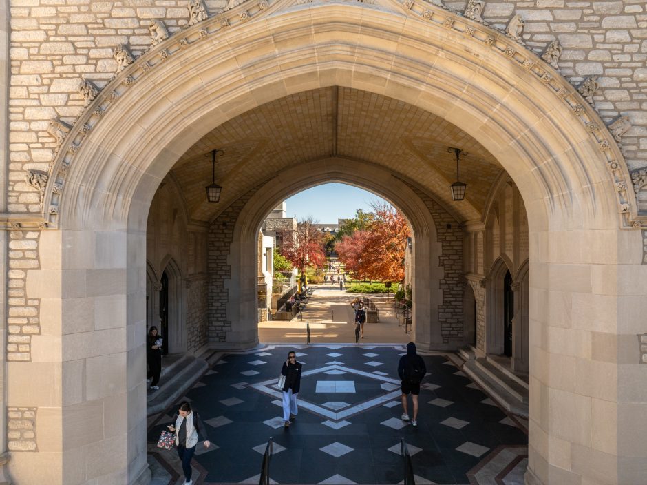 Students walking beneath Memorial Union archways
