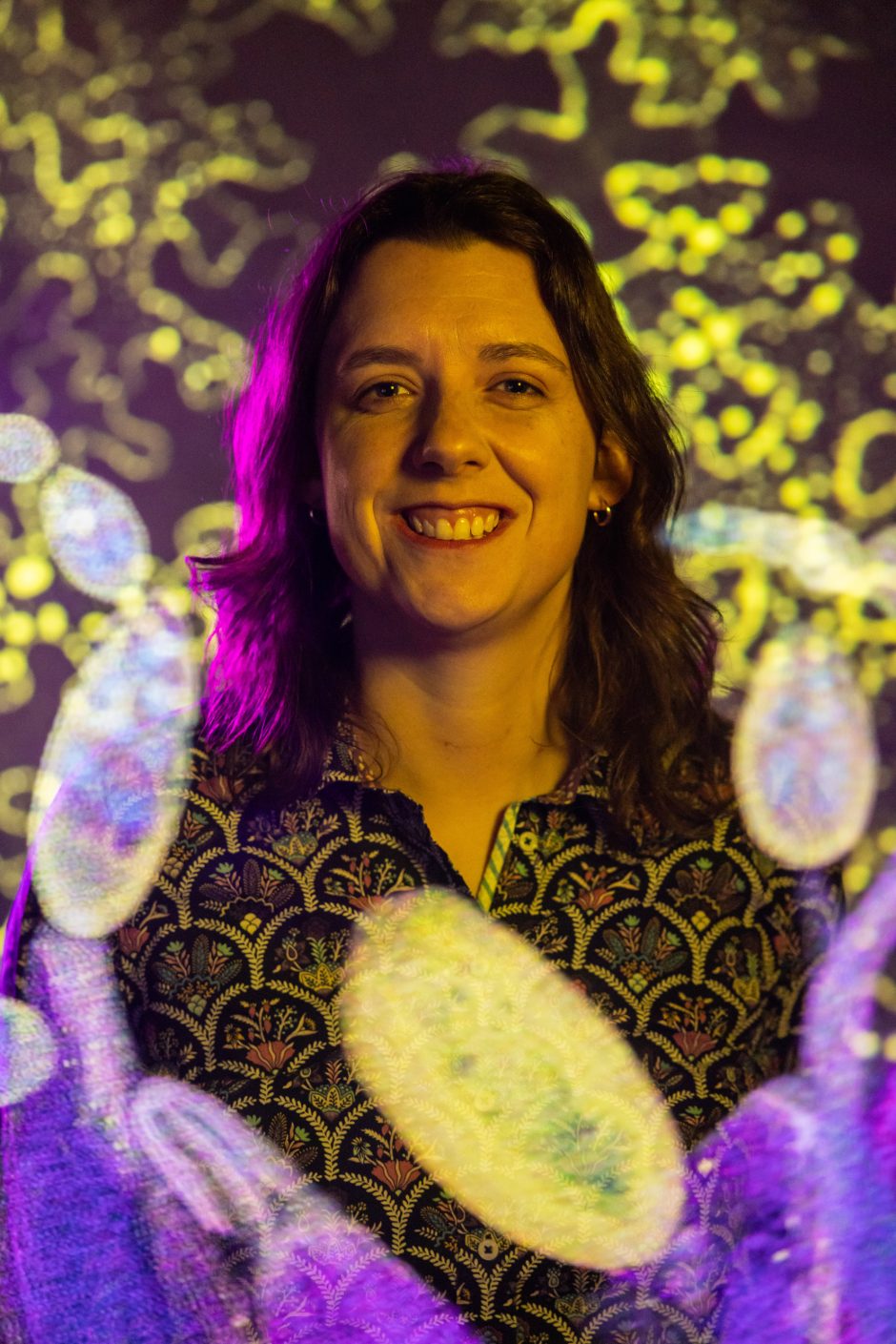 Portrait of professor with designs of purple and gold