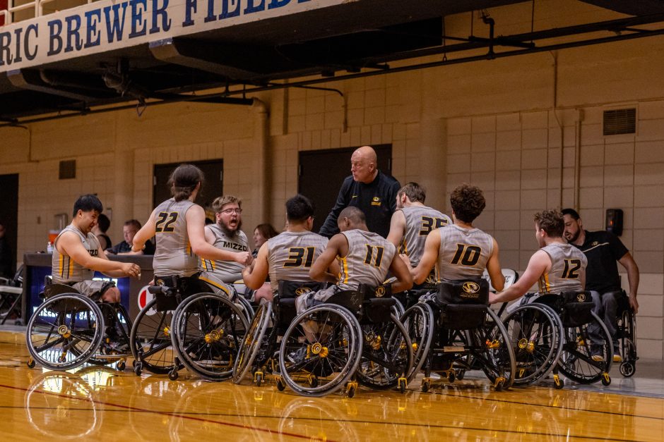 Wheelchair basketball players in a huddle