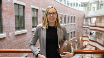 Courtney Cothren portrait while holding a football