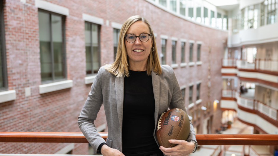 Courtney Cothren portrait while holding a football