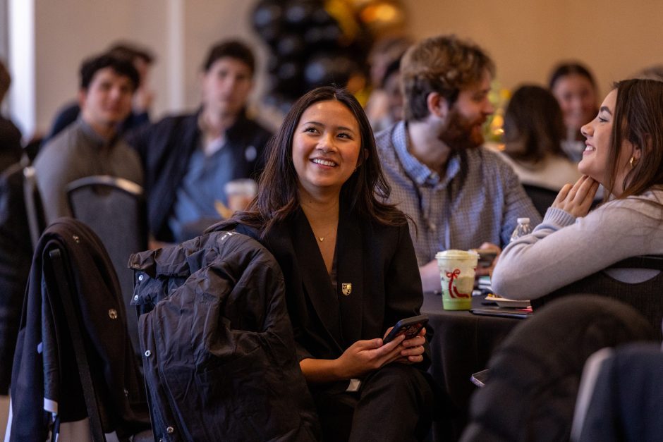 Student at table with phone