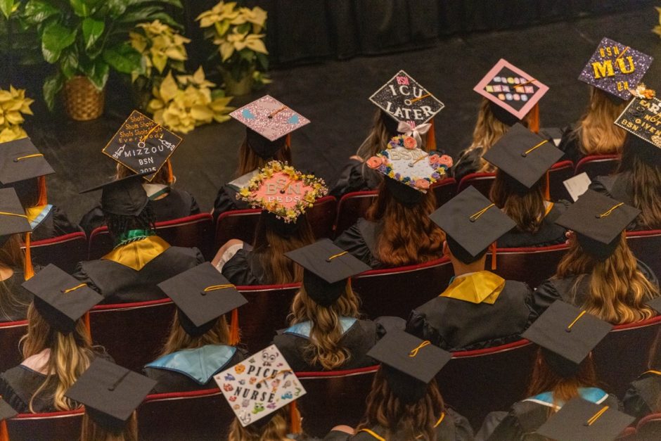 large group of graduates in caps and gowns
