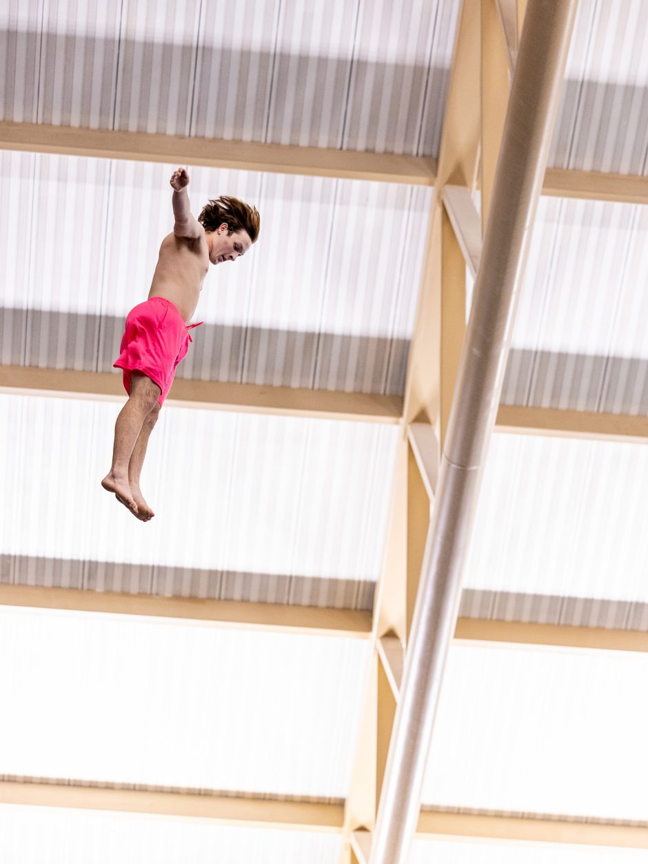 Student jumping from a high dive