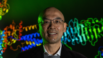 Jack Cheng portrait with a protein structure in the background