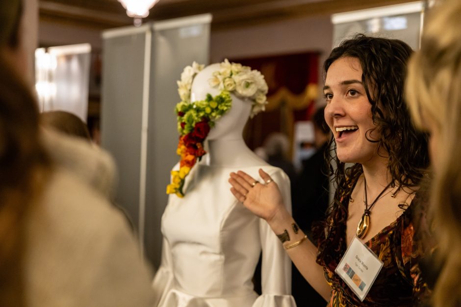 Student points to artwork