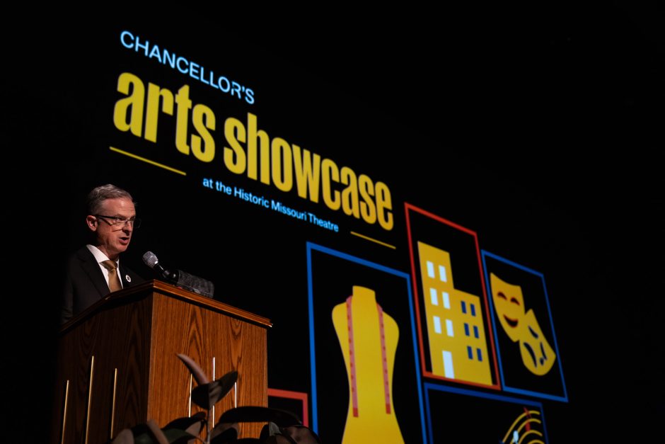 Person speaking at a podium on stage