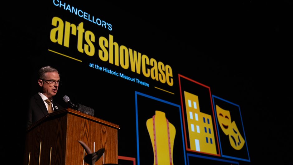 Person speaking at a podium on stage